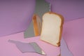 Home made organic sliced bread with broken mirror in pink purple room Royalty Free Stock Photo