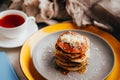 Home made pancackes for breakfast on gray and yellow plate. Royalty Free Stock Photo