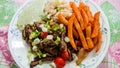 Home made Peruvian lomo saltado on plate Royalty Free Stock Photo