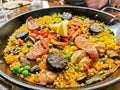 Homemade Spanish Paella with black chorizo sausages  served in black pan Royalty Free Stock Photo