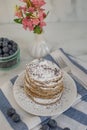 Home made lemon pancakes with poppy seeds on a breakfast table Royalty Free Stock Photo