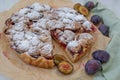 Home made vanilla almond tarte with plums with crumble