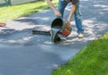 Home maintenance. Do it yourself driveway resealing.