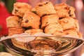 Home make many scones are placed on a beautiful brass plate