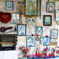 Home with christian altar and pictures of Jesus, Fijian home with religious photos and saints sculptures