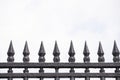 Home metal fence old vintage style with sharp spikes Royalty Free Stock Photo