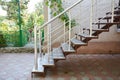 Home metal staircase outdoors. Building new metal steps in house entrance door Royalty Free Stock Photo