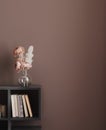 Home mockup, flower in vase on shelf, blank wall mockup