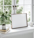 Home mockup, frame close up standing on windowsill with flower and books