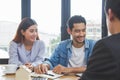 home moving and relocation concept. Happy asian couple talking with apartment landlord from real estate agent Royalty Free Stock Photo