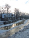 Home near river in winter Royalty Free Stock Photo