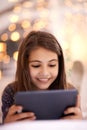 Home, night or kid with tablet for movies, playing games or watching fun videos on streaming website. Girl, house or Royalty Free Stock Photo