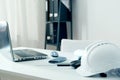 Home office of an architect with white helmet Royalty Free Stock Photo