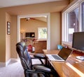 Home office and computer and chair with brown walls. Royalty Free Stock Photo