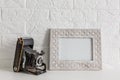 Home office concept. Empty wooden picture frame mockup. White wall background. Scandinavian interior design. Royalty Free Stock Photo