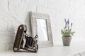 Home office concept. Empty wooden picture frame mockup. White wall background. Scandinavian interior design. Royalty Free Stock Photo