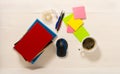 Home office concept. Work from home. Books and cafe cuo on the white wooden background. Top view. Sweden.