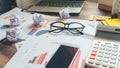 Home Office Desk Concept. Laptop, and calculator for accountant or bookkeeper plan annual budget report and tax.Computer, Crumpled Royalty Free Stock Photo