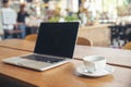 Home Office Desk Concept.Laptop and cup of coffee place on wooden desk. Computer for planner to plan job, working space at home Royalty Free Stock Photo