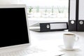 Home office desk with laptop, file folders and a cup of coffee. Royalty Free Stock Photo