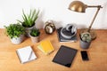 Home office desk with tablet computer smartphone notebook houseplants, working space at home Royalty Free Stock Photo