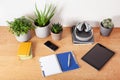 Home office desk with tablet computer smartphone notebook houseplants, working space at home Royalty Free Stock Photo