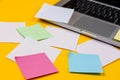 Home office desk workspace with laptop and paper sticker on yellow background. Flat lay, top view work business concept. Work at Royalty Free Stock Photo