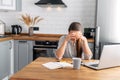 Young woman works from home using laptop. Royalty Free Stock Photo