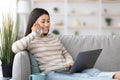 Home Office. Happy Young Asian Freelancer Lady Using Cellphone And Laptop Royalty Free Stock Photo