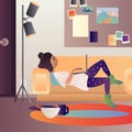 Home office in living room. Girl works on computer lying on couch. Stay home concept