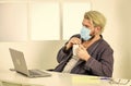 Home office. Remote job. Worker in medical mask. All you need for productive day. Totally protected. Wearing mask