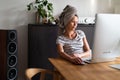 Pretty, young woman working at her computer from home Royalty Free Stock Photo