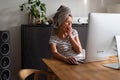 Pretty, young woman working at her computer from home Royalty Free Stock Photo