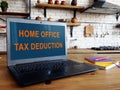 Home office tax deduction information on laptop screen. Royalty Free Stock Photo