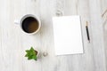 Home office workplace with cup of coffee, note pad and pen. Working from home concept. Top view - Image Royalty Free Stock Photo