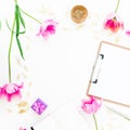 Home office workspace with clipboard, cosmetics, pink tulips and accessories on white background. Round frame. Flat lay, top view. Royalty Free Stock Photo