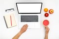 Home office workspace mockup. Laptop with blank screen, hands and accessories on white Royalty Free Stock Photo