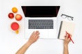 Home office workspace mockup. Laptop with blank screen, hands and accessories on white Royalty Free Stock Photo