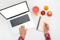 Home office workspace mockup. Laptop with blank screen, hands and accessories on white Royalty Free Stock Photo