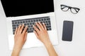 Home office workspace mockup. Laptop with blank screen, hands and accessories on white Royalty Free Stock Photo