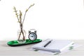 Home office workspace mockup with notebook, pen, alarm clock, plant potted and accessories on white wood desk background, copy Royalty Free Stock Photo