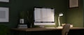 Home office workspace at night with pc computer mockup, light from table lamp over the green wall Royalty Free Stock Photo