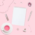 Home office workspace. Notebook with copyspace. Flat lay, social media. Woman fashion accessories and flowers on pink background. Royalty Free Stock Photo