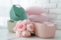 Home organizers colored baskets on white table