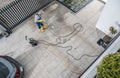 Home Owner Pressure Washing His Dirty Driveway Royalty Free Stock Photo