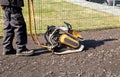 Home owner use plate compactor tool to build parking lot with recycled asphalt.