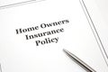 Home Owners Insurance Policy with a pen