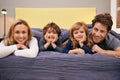 Home, parents and kids portrait in bed with love, support and bonding together with a smile. Happy, family and children Royalty Free Stock Photo