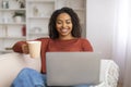 Home Pastime. Young Black Woman Resting With Coffee And Laptop Computer Royalty Free Stock Photo