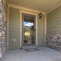 Home with a porch and reflective glass front door Royalty Free Stock Photo